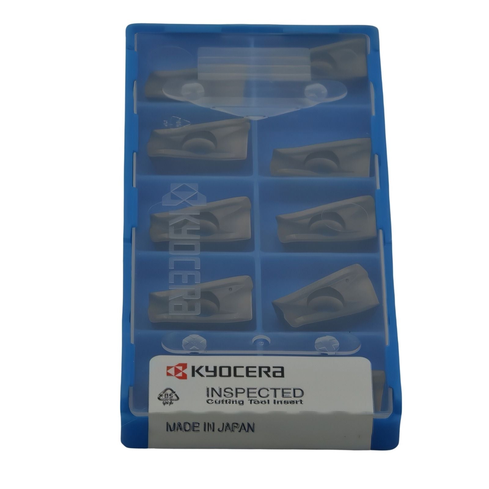 Packaged cutting tool inserts with Kyocera branding on a white background